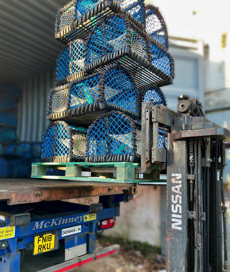 Forklift lifting a stack of blue lobster creels onto a truckbranding.